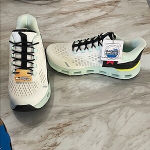 Skechers White and Black Slip-Ins with Mint Accents